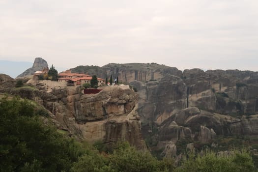 View onto the Monastery of the Holy Trinity from a distance, Meteora, Greece 2021