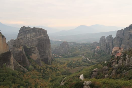 Spectacular view onto Monasteries of St. Nicholas Anapafsas, Roussanou surrounded by rock pillars, Meteora, Greece 2021