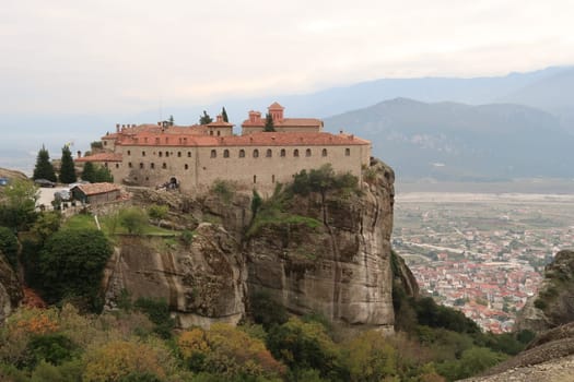 Picturesque view on the St. Stephen's Monastery with the town of Kalambaka in the background, Meteora, Greece 2021