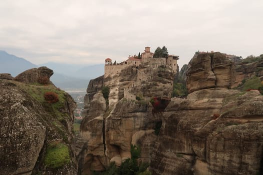 The Monastery of Varlaam appearing between rock formations, Meteora, Greece 2021
