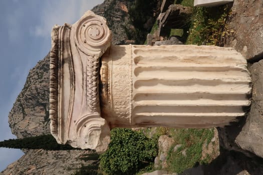 Remaining part of a beautifully decorated pillar at the ancient site of Delphi, Greece 2021