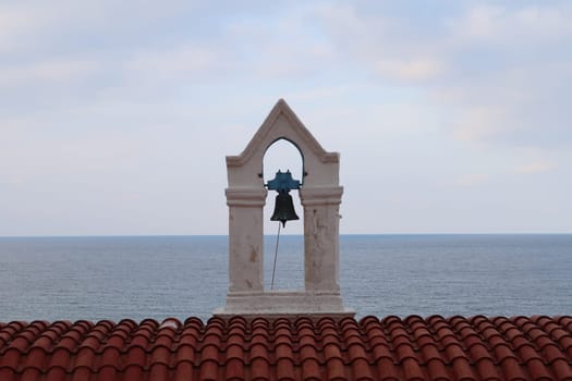 Picturesque bell tower of the Agia Kyriake Church in Chania Crete with the sea in the background, Crete, Greece 2021