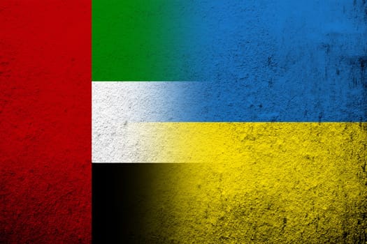 National flag of United Arab Emirates with National flag of Ukraine. Grunge background