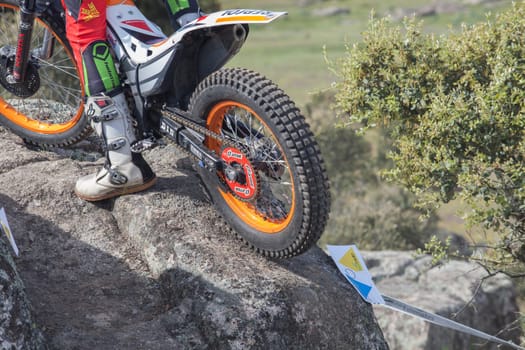 Merida, Spain - April 10th, 2022: Motorcycle trial Extremadura Championship. Prod on rock