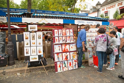 Montmartre Paris, painter at the place du tertre, tourism attraction in France, artists drawing portraits, Paris at the Montmartre on the 04.08.2017