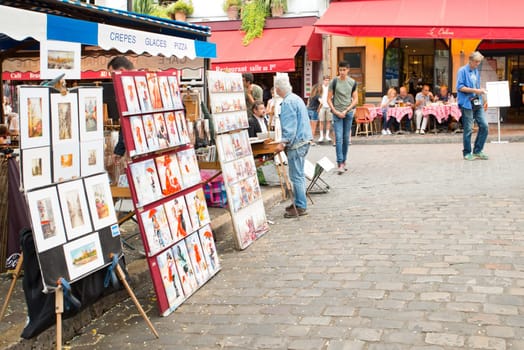 Montmartre Paris, painter at the place du tertre, tourism attraction in France, artists drawing portraits, Paris at the Montmartre on the 04.08.2017