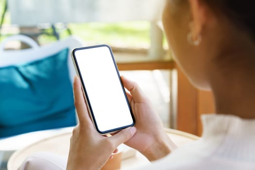 A women holding phone showing white screen