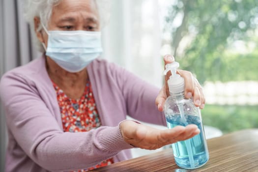 Asian elder senior woman patient wearing a protective mask for protect pollution environment and covid-19 coronavirus.