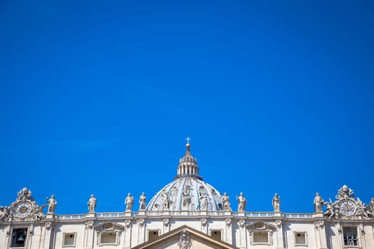 St Peter Basilica detail with a blue sky background for copy space - Rome, Vatican State