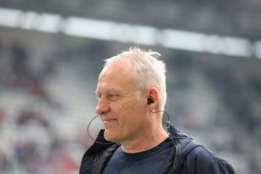 Coach Christian Streich (Freiburg) laughs during the TV interview before the game of the 1st FBL: 21-22: 31st Sptg. SC Freiburg vs Borussia Mönchengladbach... DFL REGULATIONS PROHIBIT ANY USE OF PHOTOGRAPHS AS IMAGE SEQUENCES AND/OR QUASI-VIDEONann.. Photo: Joachim Hahne/johapress
