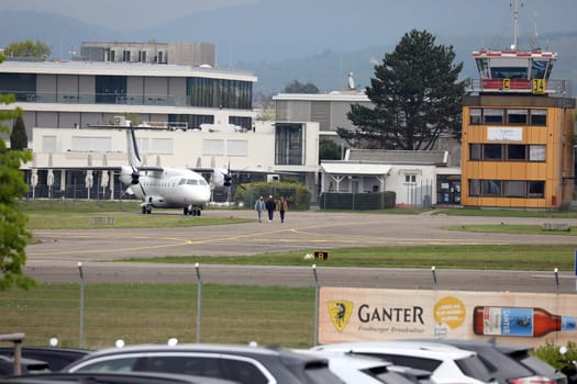 To the left of the tower is the Dornier Do 326 passenger aircraft with the Bundesliga club SC Freiburg for the game in Freiburg - ... 1. FBL: 21-22: 31. Sptg. SC Freiburg vs Borussia Mönchengladbach... DFL REGULATIONS PROHIBIT ANY USE OF PHOTOGRAPHS AS IMAGE SEQUENCES AND/OR QUASI-VIDEONann.. Photo: Joachim Hahne/johapress