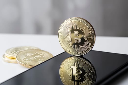 Bitcoin cryptocurrency trading on smartphone close up