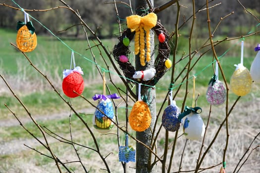 Rural woman decorate an Easter tree