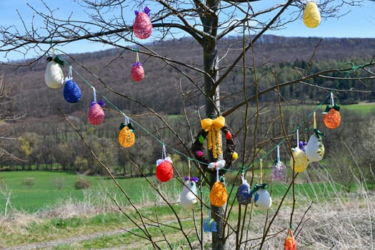 Rural woman decorate an Easter tree