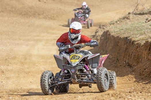 MOHELNICE,  CZECH REPUBLIC - APRIL 16, 2022: Girl Kavalova on a quad bike is passing turn in International Championship of Czech Republic in Sidecarcross, category Quad on April 16, 2022, in Mohelnice