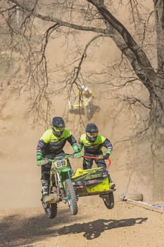 MOHELNICE, CZECH REPUBLIC - APRIL 16, 2022. Riders jump with motorbike. The next crew is behind them in the "Sidecarcross Championship of Czech Republic"" on April 16, 2022 in  Mohelnice, Czech Rep."