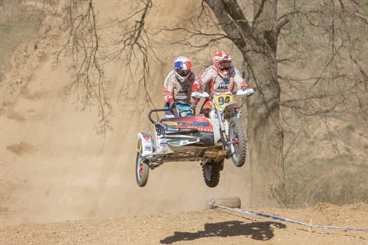 MOHELNICE, CZECH REPUBLIC - APRIL 16, 2022. The winners of the sidecarcross race are in a high jump in the "Sidecarcross Championship of Czech Republic"" on April 16, 2022 in the town of Mohelnice."