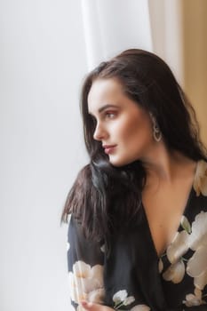 Side view portrait of atractive dark haired girl. Vertically.
