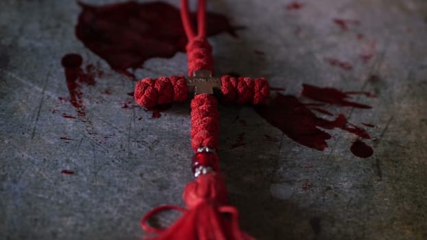 Close up of cross of jesus on bloody background