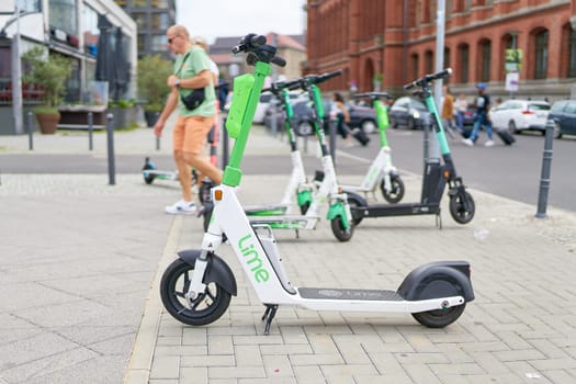 Parked electric scooter of the Lime group in the city center of Berlin