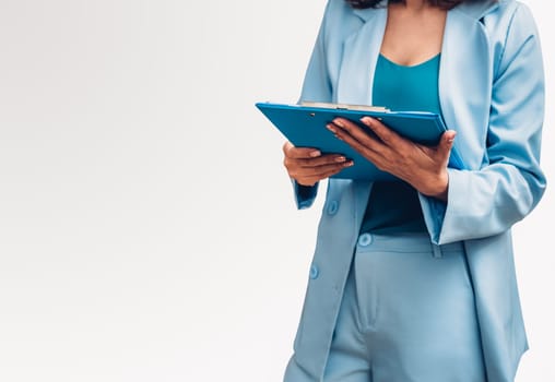 Portrait of Young business woman wearing a blue suit her holding file folder document studio shot isolate on white background