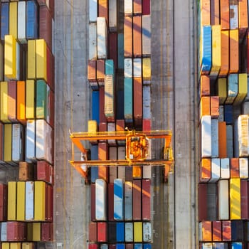 Aerial view of shipping container port terminal. Colourful pattern of containers in harbor. Maritime logistics global inport export trade transportation
