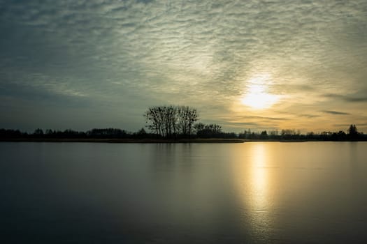 The glow of the sun in the frozen lake, Stankow, Poland