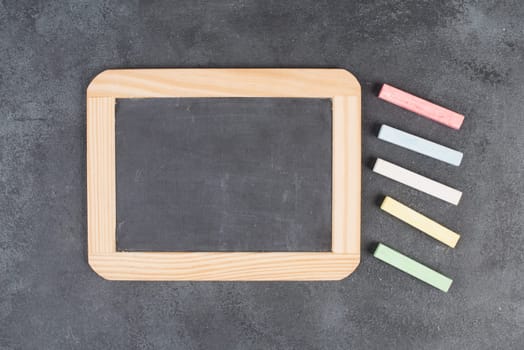 Blank blackboard, copy space for text, advertising business, education concept, school class, empty background for a message, colorful chalk
