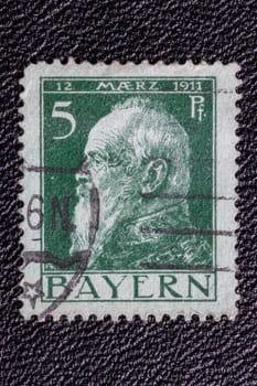 Potsdam, Germany - APR 26, 2022. German Empire. Close-up of a stamp showing a portrait of Luitpold Karl Joseph Wilhelm of Bavaria, on the occasion of his 90th birthday on 12 March 1911.