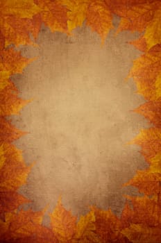 Pumpkin and maple leaves design on textured background