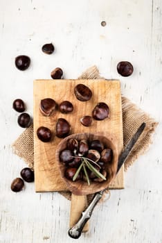 Chestnuts on wooden cutting board