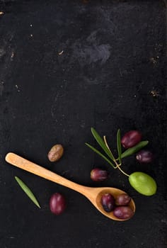 Fresh olives on black rustic background