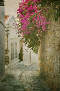 Old street in Lindos, Rhodes island, Greece. Texture added.