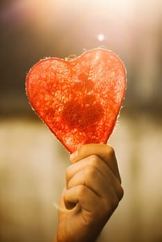 Red valentine heart in hand