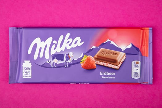 WETZLAR GERMANY - 2022-04-11: Milka chocolate bar on purple background. Milka milk chocolate bar. Milka is a brand of chocolate confection which originated in Switzerland in 1901.