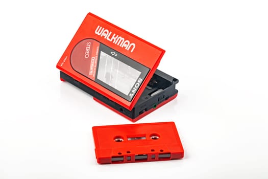 WETZLAR, GERMANY: 2022-04-16: Beautiful red vintage SONY WALKMAN WM-24 over bright background.