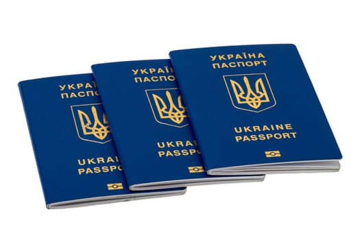 Three passports of Ukrainian citizens or migrants for visa-free travel to the European Union isolated on a white background. Clipping path. Refugees in the Ukraine conflict with Russia.