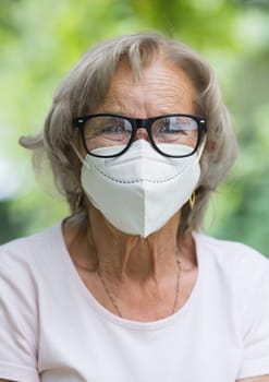 Elderly woman wearing a protective face mask against corona virus