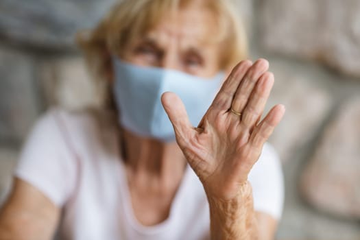 Elderly woman with a face mask during lockdown
