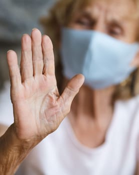 Elderly woman with a face mask during lockdown