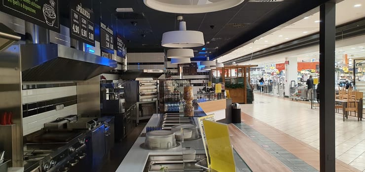 empty food and restaurant at the counter area with chairs upside-down for quarantine and lockdown in COVID-19 times waiting to open and make money