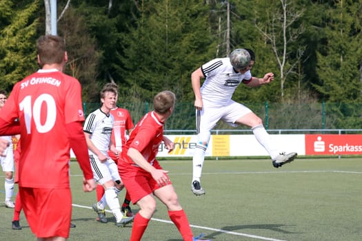 Kevin Steiert (SV Hinterzarten) clears his head in front of the attacking Öfinger Mathias Zeller in the game of the football KL A Black Forest - 21st season 21-22 - SV Hinterzarten vs SV Öfingen