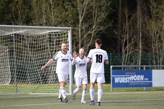 Mario Groß (SV Hinterzarten) and Goran Misic (SV Hinterzarten) congratulate the scorer on the 1:0,Kay Ruf (SV Hinterzarten) at the match of the football KL A Black Forest - 21st season 21-22 - SV Hinterzarten vs SV Öfingen