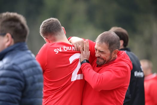 Coach Francesco Pastore (SV Öfingen) himself lends a hand to make Rocco Pastore fit again after a fall on the shoulder - it helped little,the player had to be replaced in the game of the football KL A Black Forest - 21st Sptg. season 21-22 - SV Hinterzarten vs SV Öfingen
