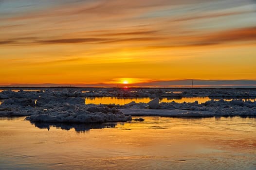 Sunset on the river during an ice drift. High quality photo