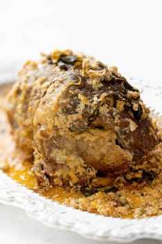 close up of rustic italian pork shoulder  in milk