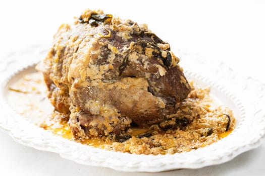 close up of rustic italian pork shoulder  in milk