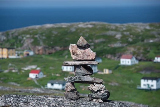 Inukshuk oversees Battle Harbor Newfoundland and Labrador