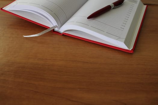 Office desk, workplace with notebook, pen. Business background..
