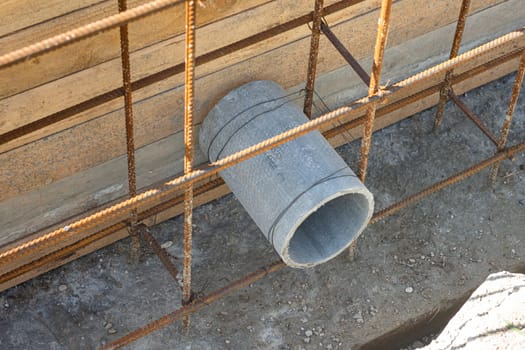 Laying a sleeve for communications during the construction of a strip foundation